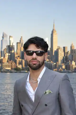 Asher Yanez, Founder and CEO of Ignite Co., photographed in front of the New York City skyline